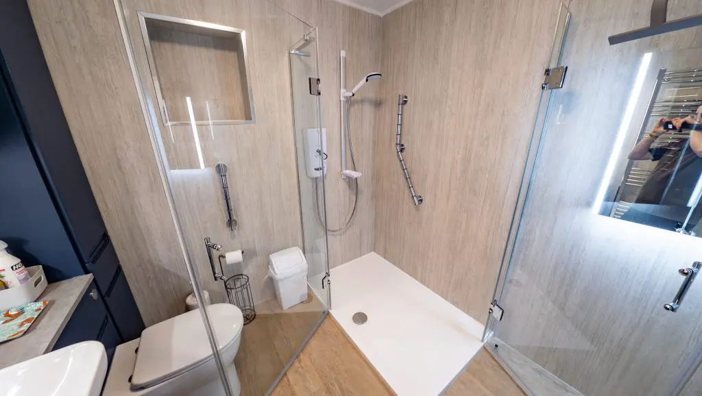 An accessible shower with corner entry doors to allow wider access
